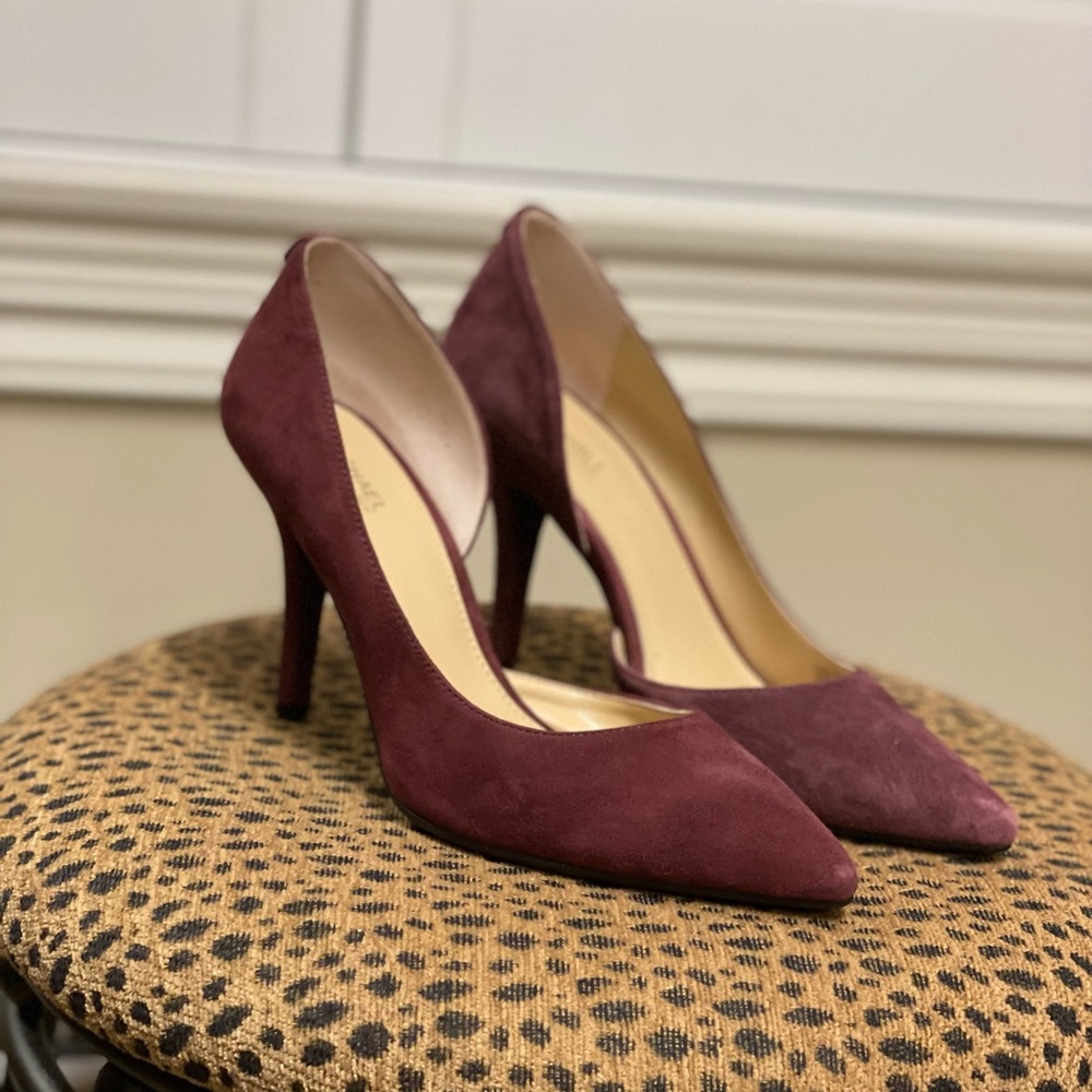 Gently used Michael Kors magenta heels with grip non slip bottom. Size 7.
